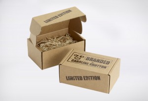 Environmental Product packaging created in Kraft e-flute corrugated and screen printed in dark brown, with the product packed in wood wool.
